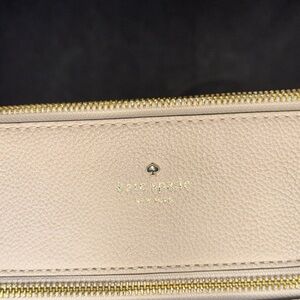 Kate Spade Cream Cosmetic Case with Gold Accents